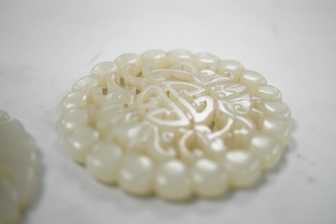 Two Chinese celadon jade circular plaques, 19th century, 5.5cm diameter